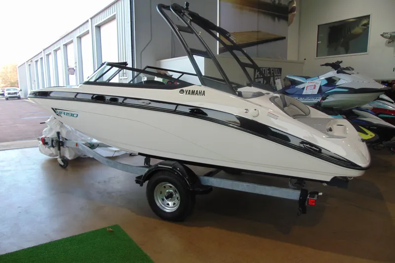 The Image of 2026 Yamaha Boats AR190 displayed indoors on a trailer. - 2