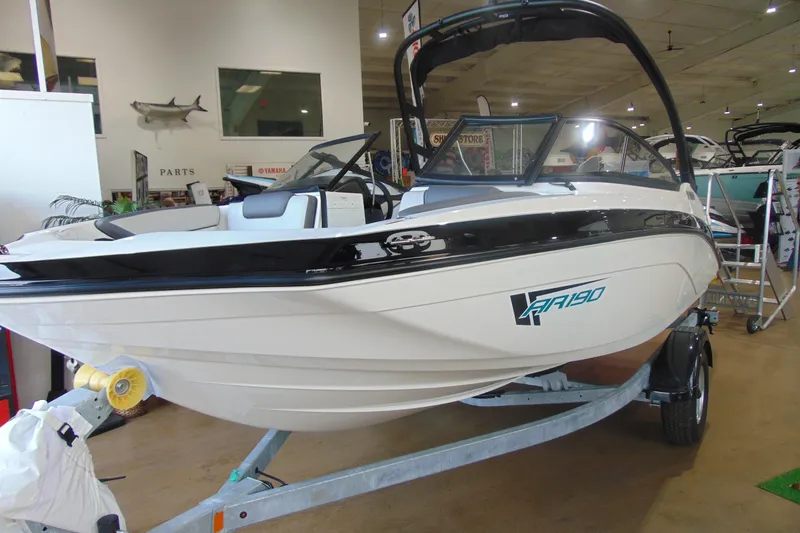 Slide: The Image of 2026 Yamaha Boats AR190 displayed indoors on a trailer, showcasing sleek design. - 4