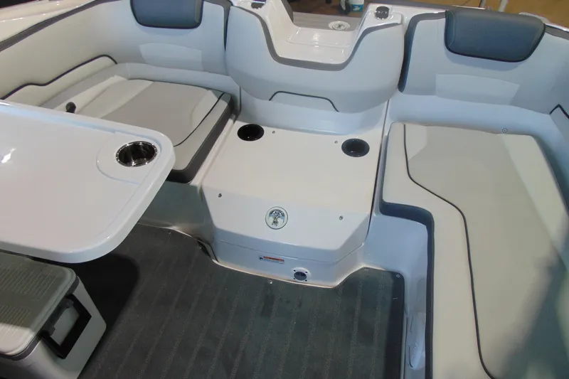 Slide: The Image of 2026 Yamaha Boats AR190 interior with seating and table, featuring modern design and cup holders. - 9
