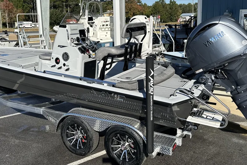The Image of 2026 Avid 21 FSX boat with Yamaha engine on a trailer, featuring Garmin electronics. - 0