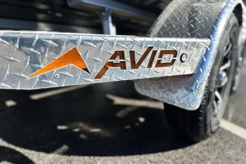 Slide: The Image of Close-up of 2026 Avid 21 FSX trailer with embossed logo on metal surface. - 10