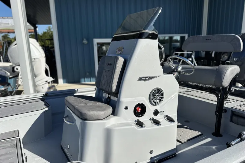Slide: The Image of 2026 Avid 21 FSX boat interior with steering console and seating. - 12