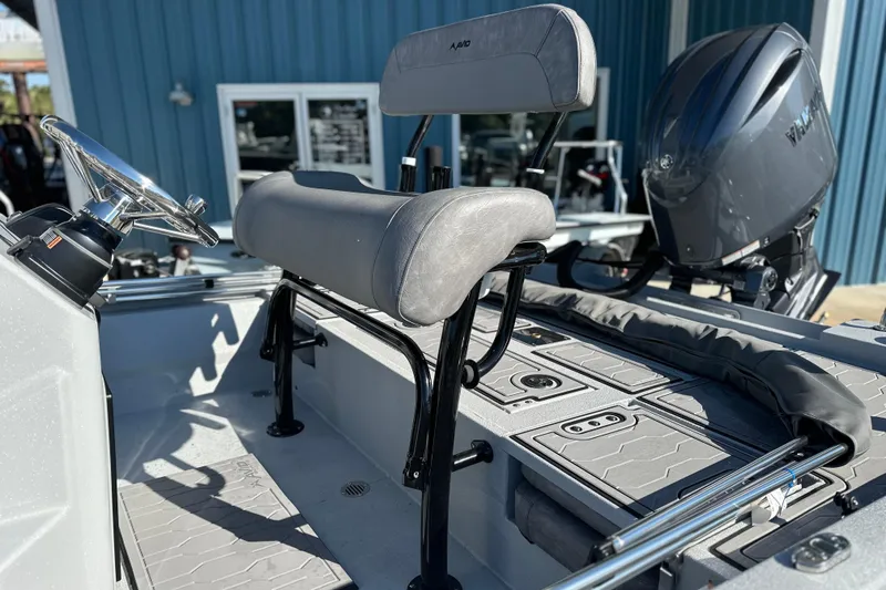 Slide: The Image of 2026 Avid 21 FSX boat interior with steering wheel and seating, showcasing modern design. - 14