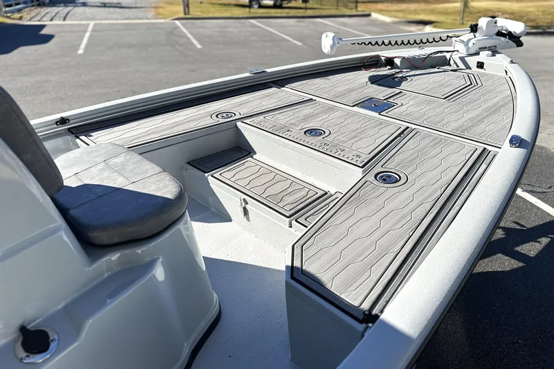 Slide: The Image of 2026 Avid 21 FSX boat deck with seating and storage compartments. - 16