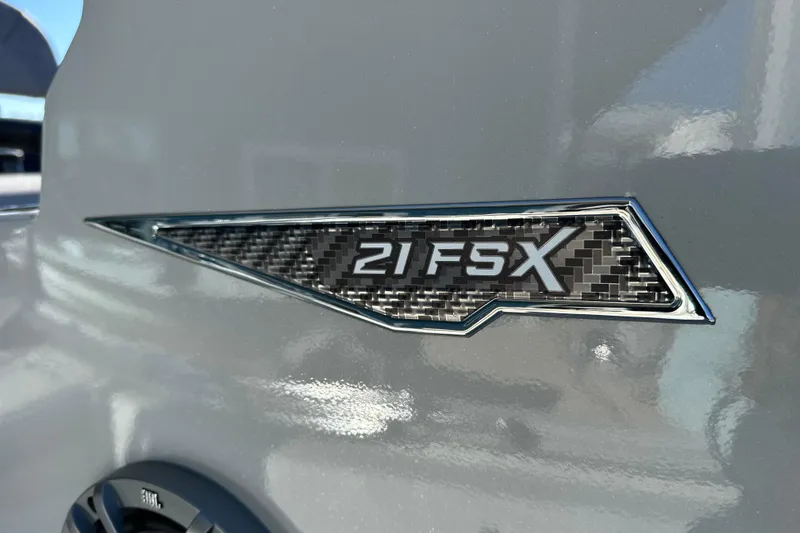 Slide: The Image of Avid 21 FSX 2026 model badge on sleek gray surface. - 17