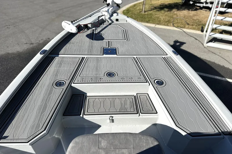 Slide: The Image of 2026 Avid 21 FSX boat deck with gray non-slip surface and measurement markings. - 18