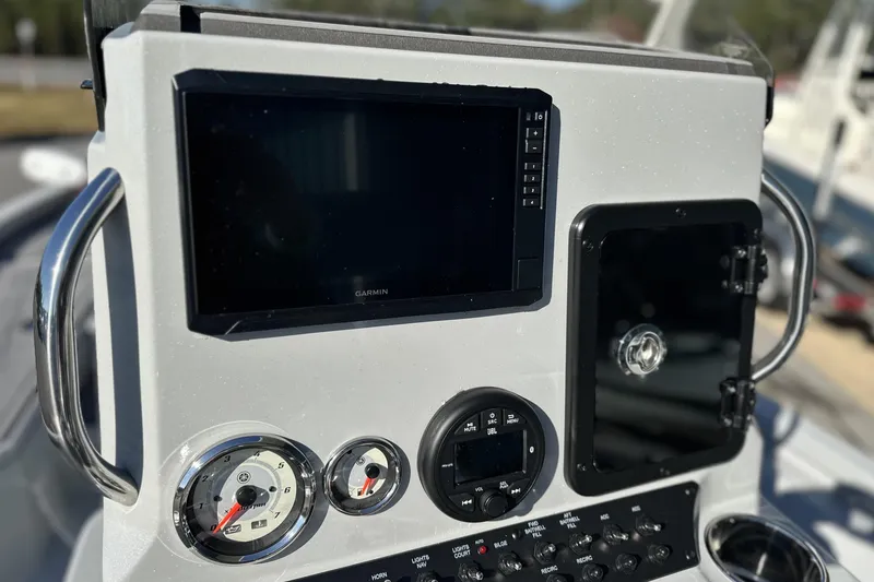 Slide: The Image of Control panel of 2026 Avid 21 FSX boat with Garmin display and gauges. - 19