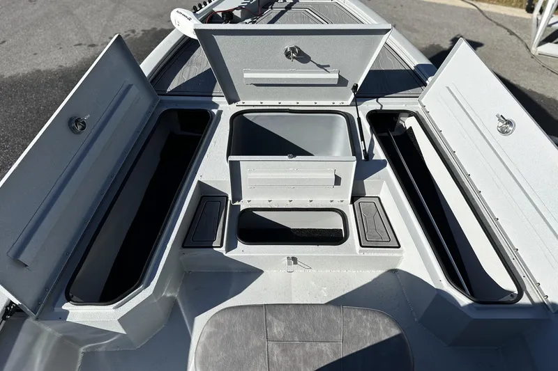Slide: The Image of 2026 Avid 21 FSX boat storage compartments open, showcasing ample space and organization. - 24