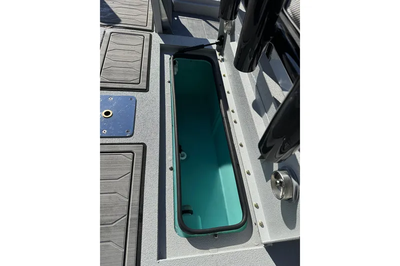 Slide: The Image of 2026 Avid 21 FSX boat interior storage compartment with sleek design and durable materials. - 25