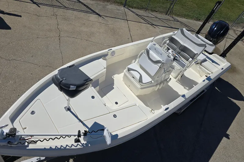 Slide: The Image of 2023 Skeeter SX230 boat with seating and motor, viewed from above on concrete surface. - 10