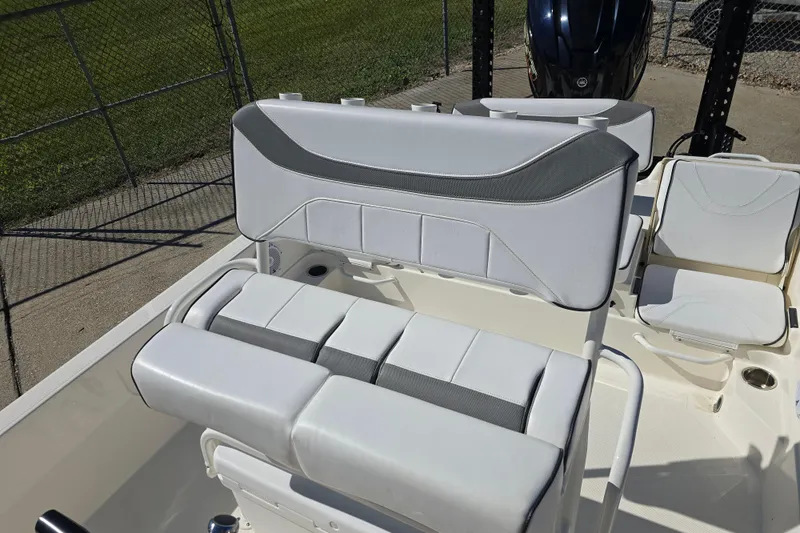 Slide: The Image of 2023 Skeeter SX230 boat interior with cushioned seating and sleek design. - 12