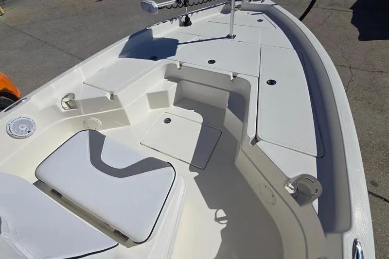 Slide: The Image of 2023 Skeeter SX230 boat interior with seating and storage compartments. - 16