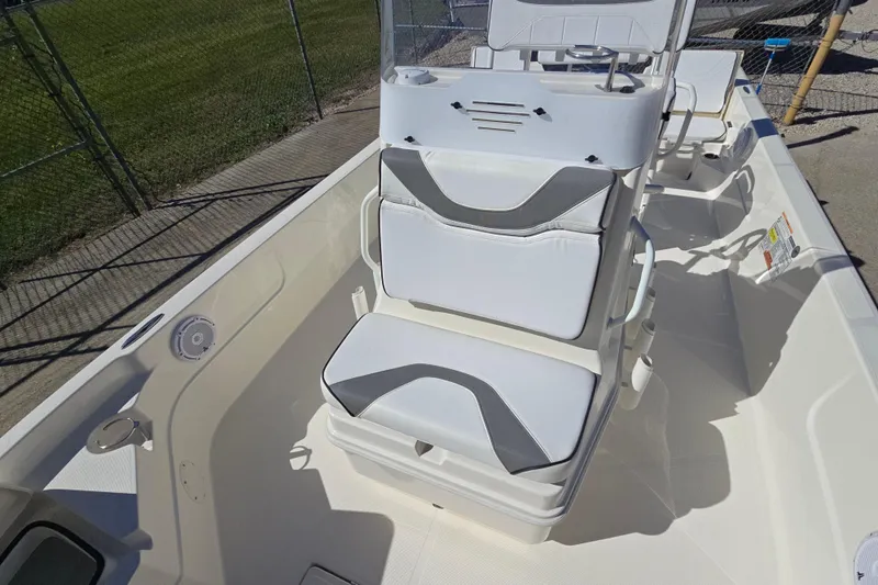 Slide: The Image of 2023 Skeeter SX230 boat interior with white seating and modern design. - 18
