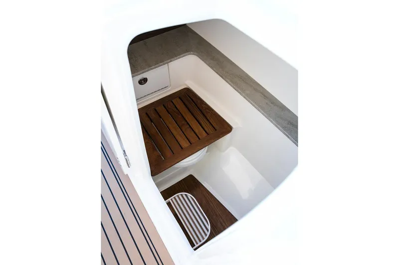 Slide: The Image of Manufacturer Provided Image: Interior view of 2021 Boston Whaler 320 Vantage boat with wooden flooring. - 23