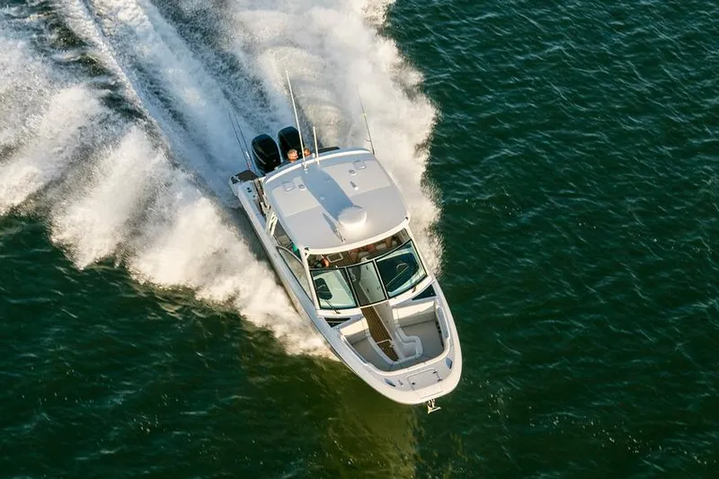 Slide: The Image of Manufacturer Provided Image: 2021 Boston Whaler 320 Vantage boat cruising on open water. - 5
