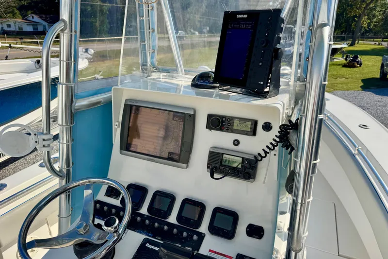 Slide: The Image of 2013 Contender 25 Tournament boat dashboard with navigation and communication equipment. - 10