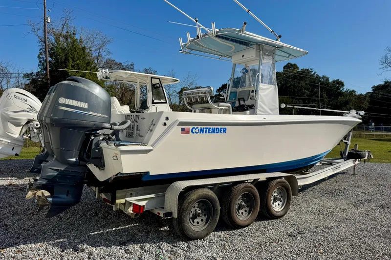 Slide: The Image of 2013 Contender 25 Tournament boat on trailer with Yamaha outboard motor. - 3