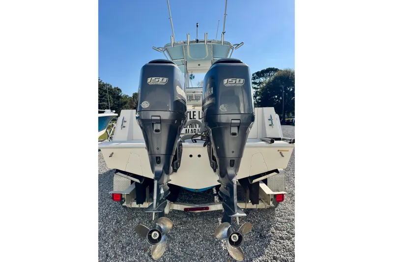 Slide: The Image of 2013 Contender 25 Tournament boat with dual Yamaha 150 outboard engines. - 5