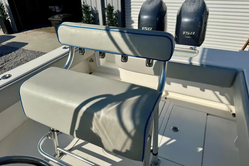 Slide: The Image of 2013 Contender 25 Tournament boat with dual Yamaha 150 engines and cushioned seating. - 7