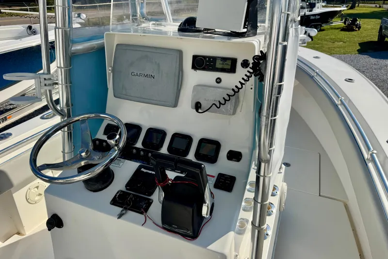 Slide: The Image of 2013 Contender 25 Tournament boat console with Garmin navigation system and controls. - 8