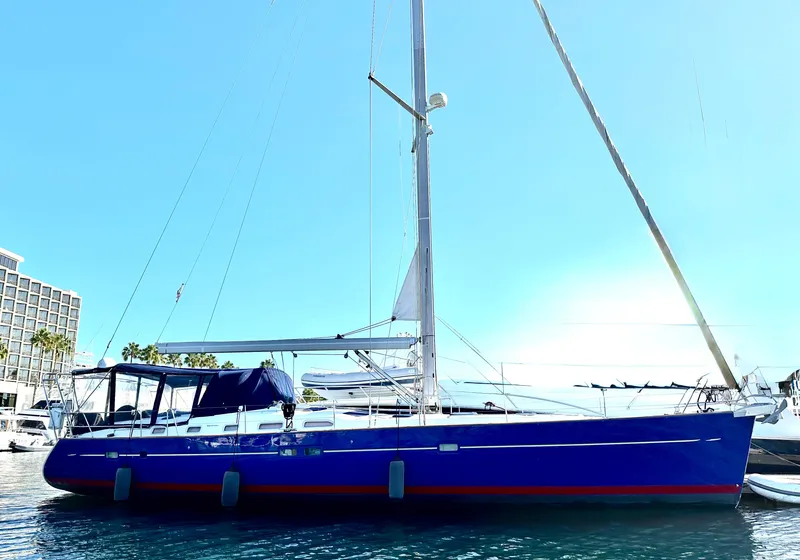 Slide: The Image of 2006 Beneteau Oceanis Clipper 523 sailboat docked in sunny marina. - 0