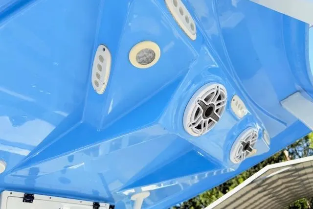 Slide: The Image of 2021 Tidewater 292 CC Adventure boat ceiling with speakers and lights, blue finish. - 13