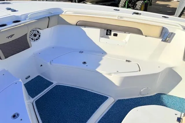 Slide: The Image of 2021 Tidewater 292 CC Adventure boat interior with seating and storage compartments. - 15