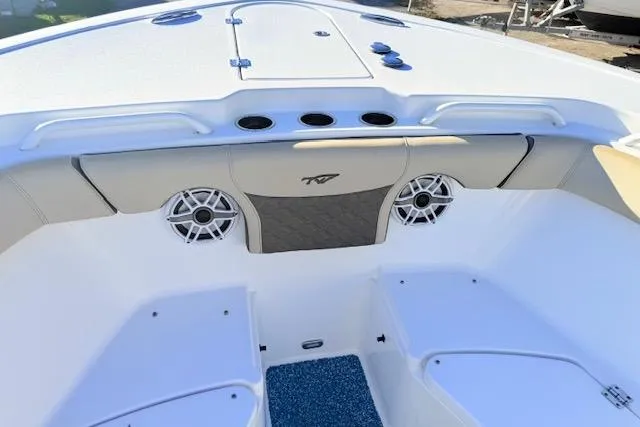 Slide: The Image of 2021 Tidewater 292 CC Adventure boat interior with speakers and seating. - 16