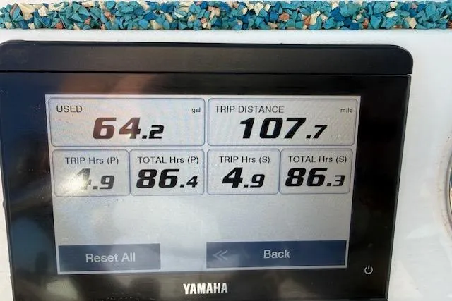 Slide: The Image of Yamaha display showing fuel usage and trip data for 2021 Tidewater 292 CC Adventure. - 21