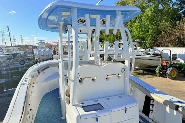 Slide: The Image of 2021 Tidewater 292 CC Adventure boat with blue T-top and rod holders. - 7