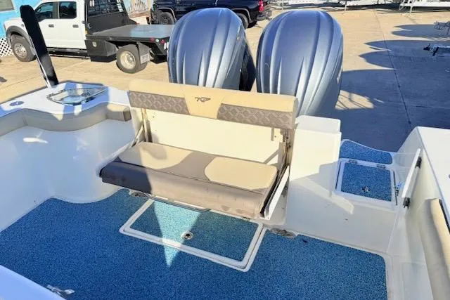 Slide: The Image of 2021 Tidewater 292 CC Adventure boat with dual engines and seating area. - 8