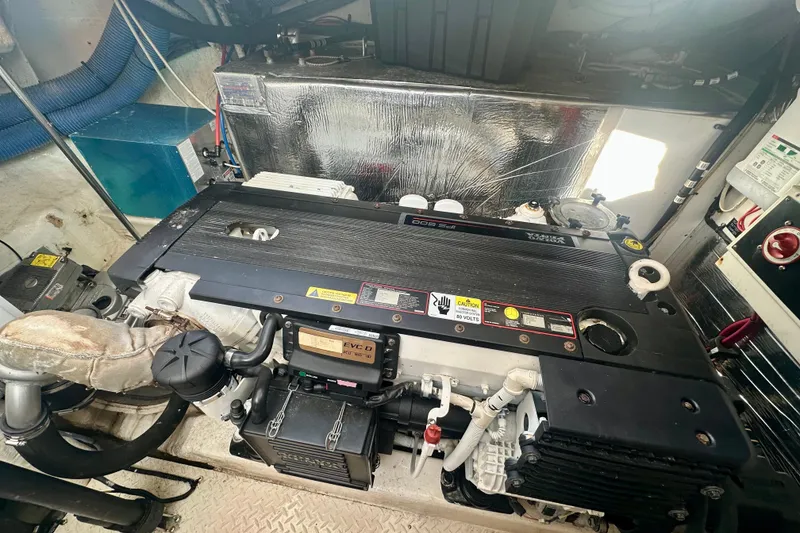 Slide: The Image of Engine room of a 2011 Cruisers Yachts 420 Sports Coupe, featuring a Volvo Penta engine. - 24