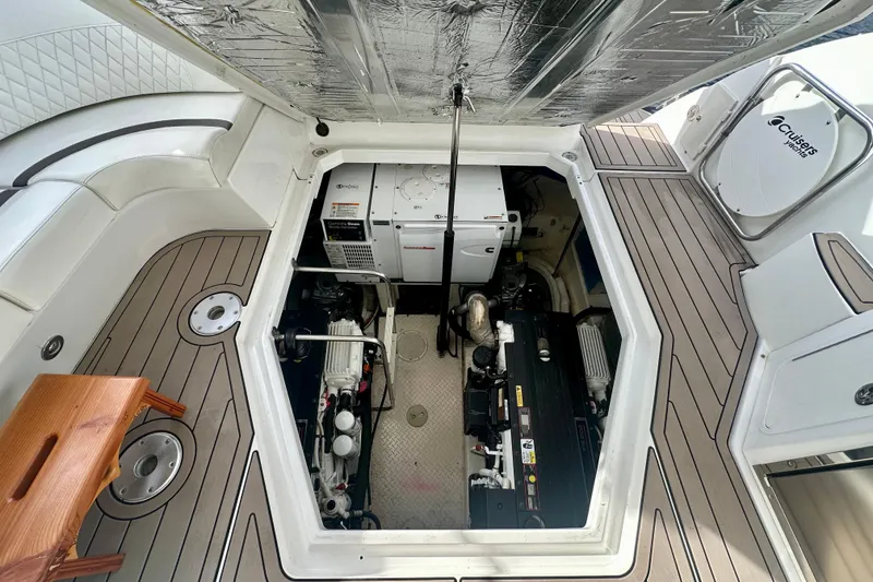 Slide: The Image of Engine compartment of 2011 Cruisers Yachts 420 Sports Coupe, showcasing mechanical components and layout. - 27