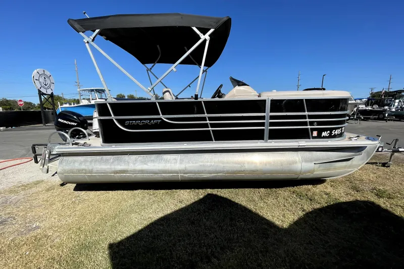 Slide: The Image of 2014 Starcraft Stardeck 190 Cruise pontoon boat with canopy and Mercury engine. - 1
