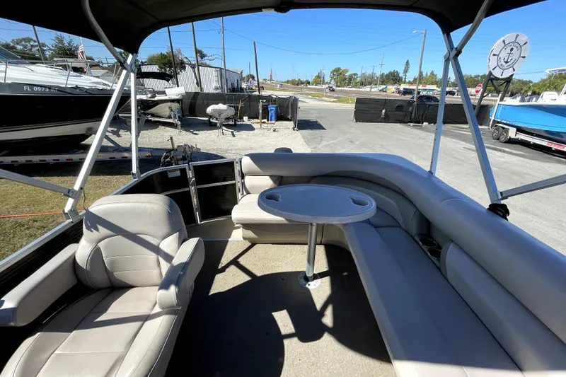 Slide: The Image of 2014 Starcraft Stardeck 190 Cruise pontoon boat with canopy on a sunny day. - 13
