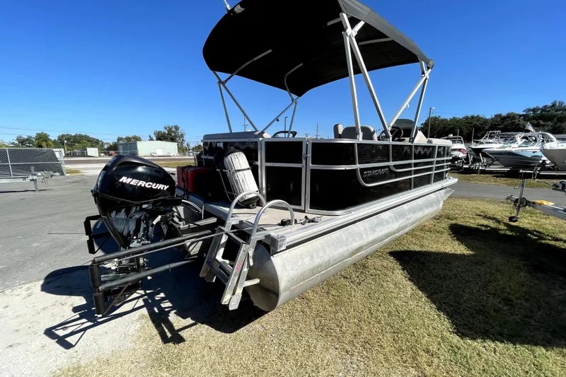 Slide: The Image of 2014 Starcraft Stardeck 190 Cruise pontoon boat with Mercury outboard motor and canopy. - 2