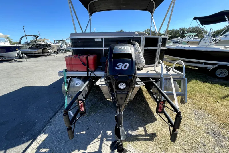 Slide: The Image of Close-up of 2014 Starcraft Stardeck 190 Cruise logo on a sleek black surface. - 3