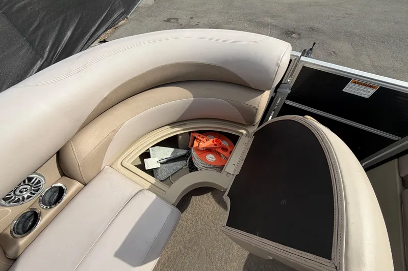 Slide: The Image of 2014 Starcraft Stardeck 190 Cruise boat interior with open storage compartment. - 30