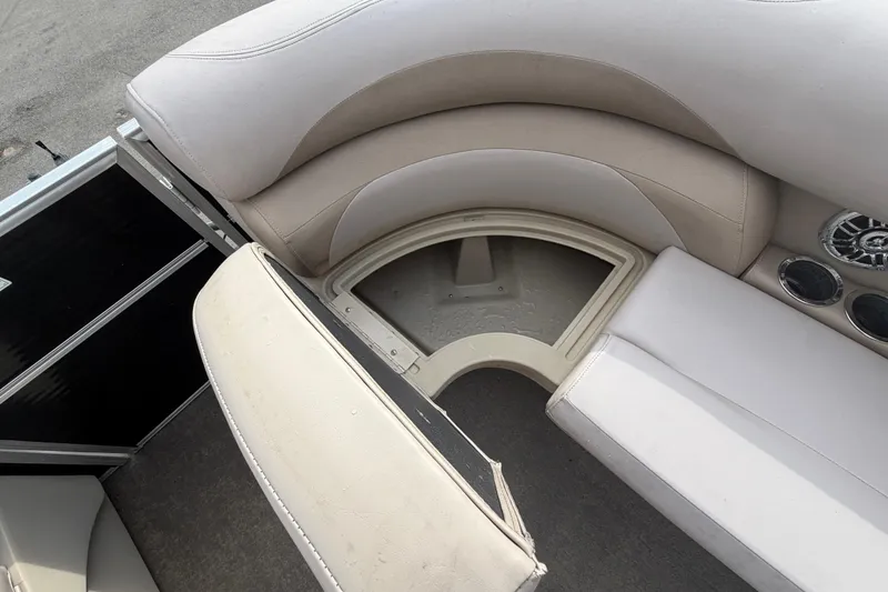 Slide: The Image of 2014 Starcraft Stardeck 190 Cruise boat interior with beige seating and storage compartment. - 32