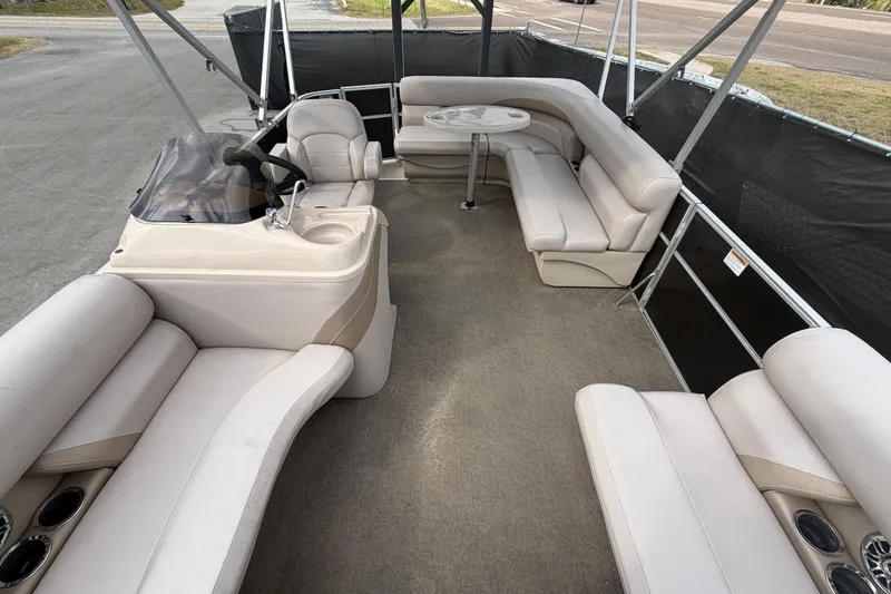 Slide: The Image of 2014 Starcraft Stardeck 190 Cruise interior with beige seating and helm. - 38