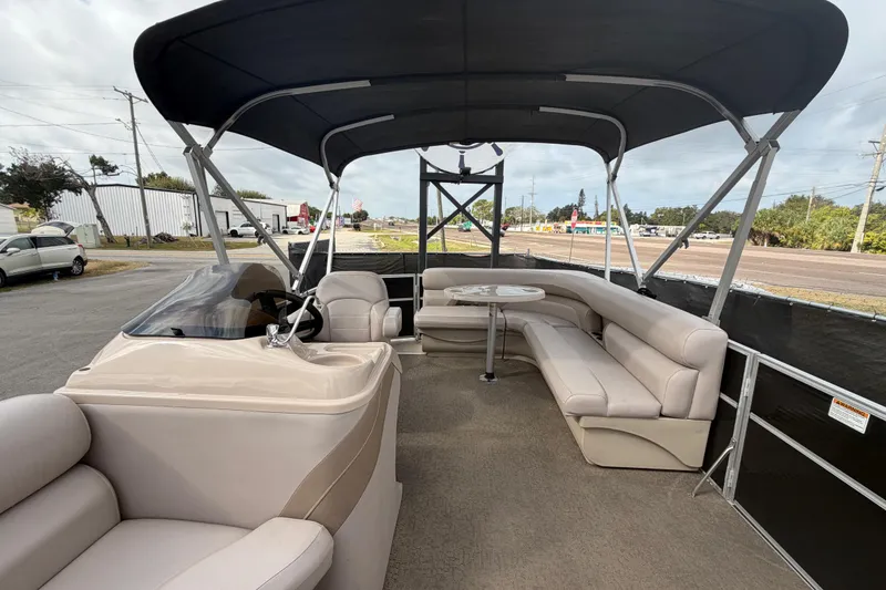 Slide: The Image of 2014 Starcraft Stardeck 190 Cruise pontoon boat interior with seating and canopy. - 39
