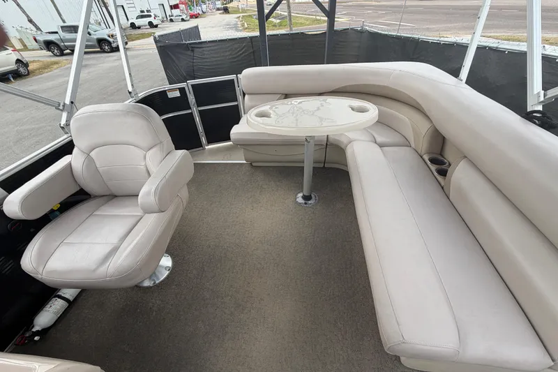 Slide: The Image of 2014 Starcraft Stardeck 190 Cruise interior with beige seating and table. - 44