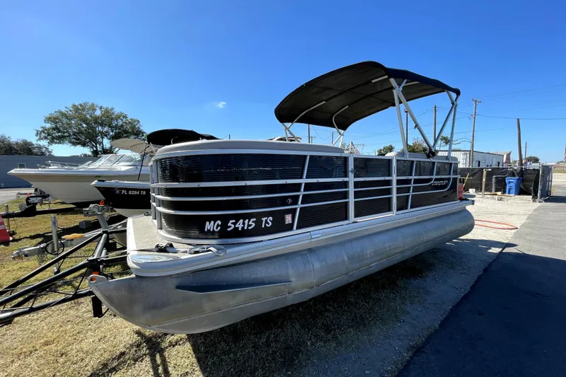 Slide: The Image of 2014 Starcraft Stardeck 190 Cruise pontoon boat with EFI 30 engine, parked outdoors. - 6