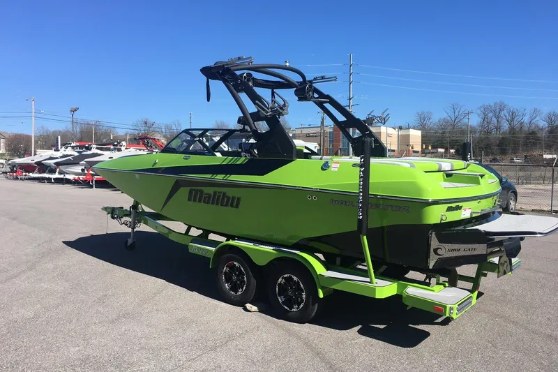 Slide: The Image of 2019 Malibu Wakesetter 21 MLX boat in vibrant green on a trailer. - 3