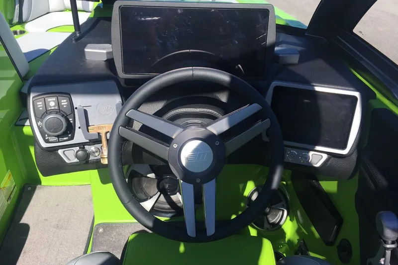 Slide: The Image of 2019 Malibu Wakesetter 21 MLX dashboard with steering wheel and control panels. - 7