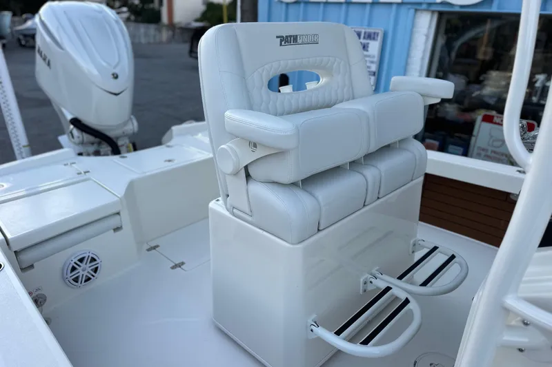 Slide: The Image of White leather seating on 2026 Pathfinder 2500 Hybrid boat, featuring Yamaha outboard motor. - 13