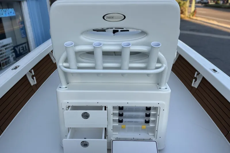 Slide: The Image of Pathfinder 2500 Hybrid 2026 boat interior with rod holders and storage compartments. - 18