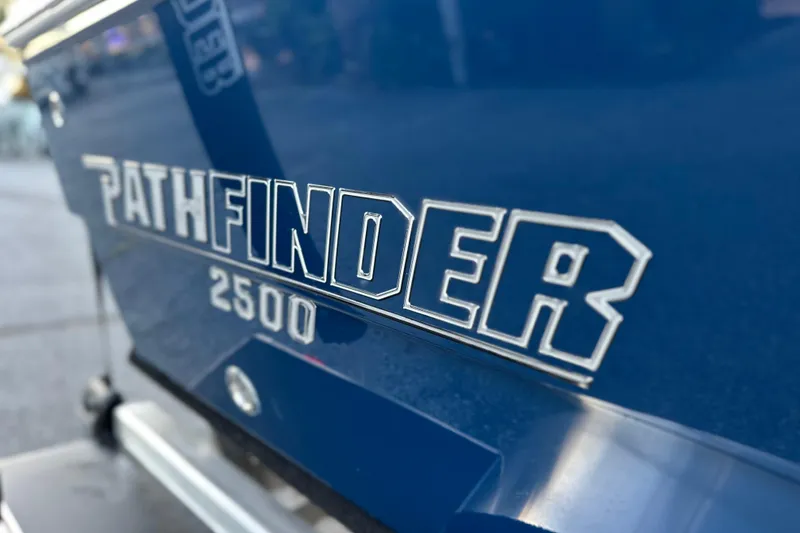 Slide: The Image of Close-up of 2026 Pathfinder 2500 Hybrid logo on blue surface. - 6