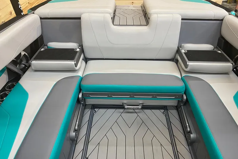Slide: The Image of 2019 Malibu Wakesetter 24 MXZ interior with gray and teal seating, modern design. - 12