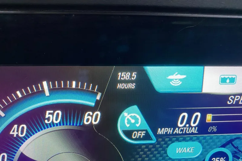 Slide: The Image of Dashboard of 2019 Malibu Wakesetter 24 MXZ showing 158.5 hours and speedometer. - 13